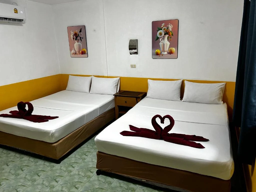 Coco's Guest House family room with two large beds