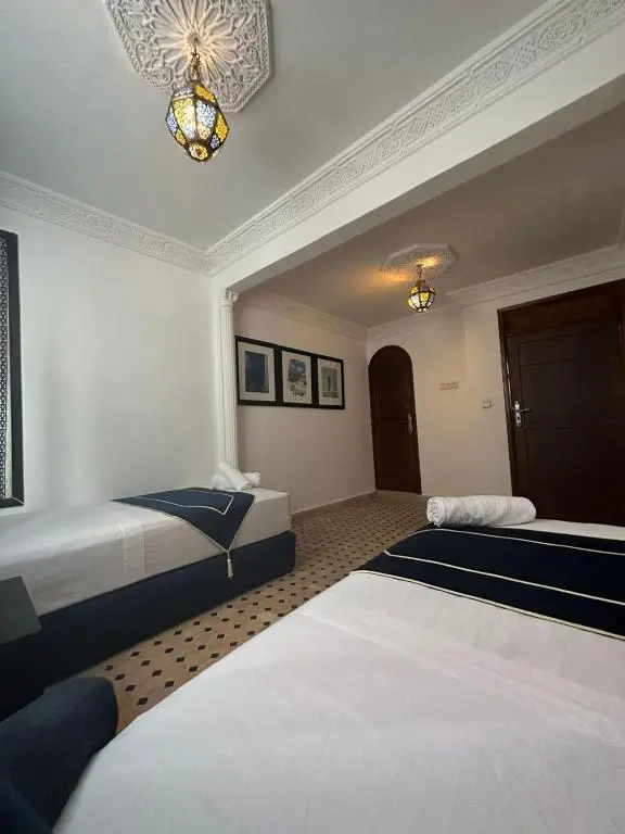 Twin room with chandelier at Kasba Blanca Tangier