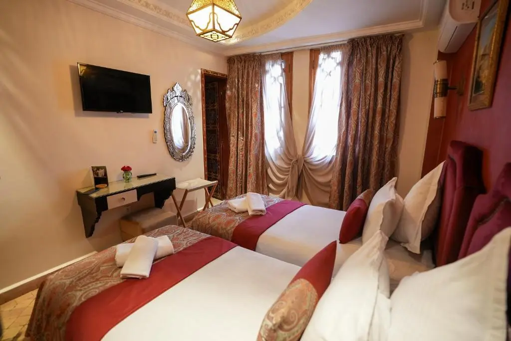 Twin room with television at Palais Zahia Tangier