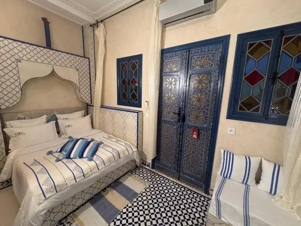 Blue patterned double room with Moroccan details at Riad Al-Qurtubi Tangier