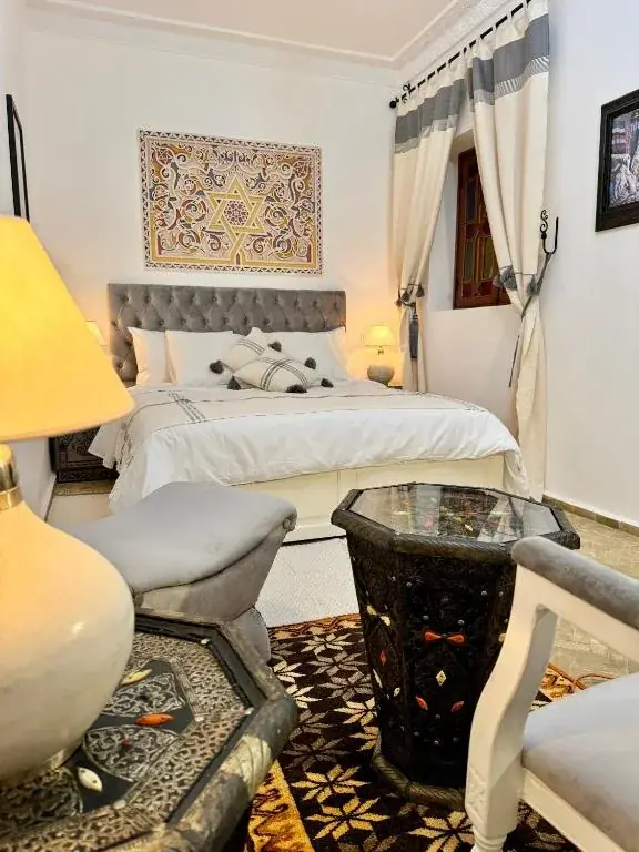 Elegant double bedroom with Moroccan furnishings at Riad Al-Qurtubi Tangier