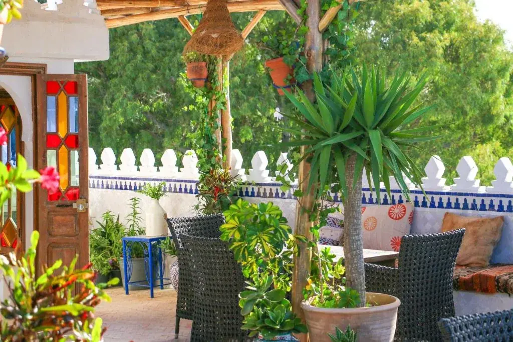 Garden terrace with outdoor seating at Riad Al-Qurtubi Tangier