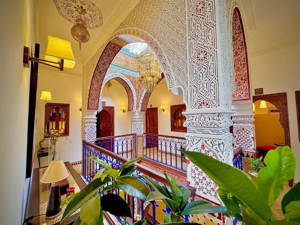 Upper gallery and carved arches inside Riad Al-Qurtubi Tangier