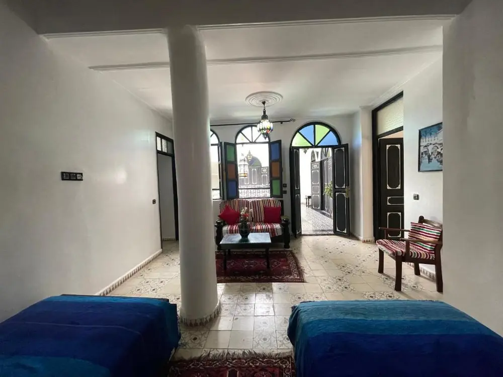 Spacious twin room and sitting area at Riad Tingis Tangier
