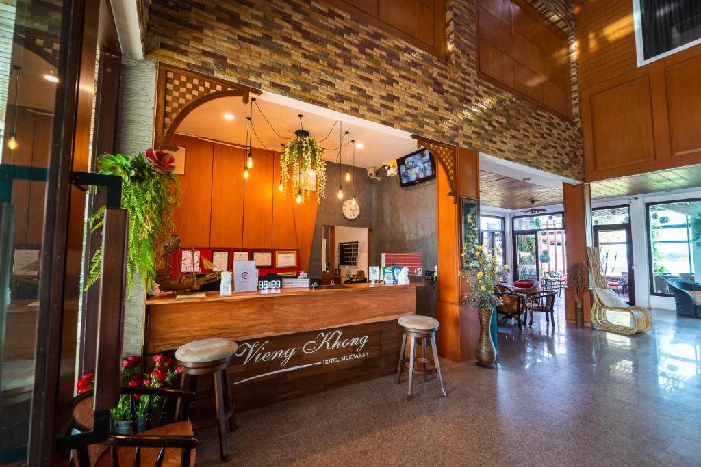 Vieng Khong Hotel reception lobby with warm wooden interior