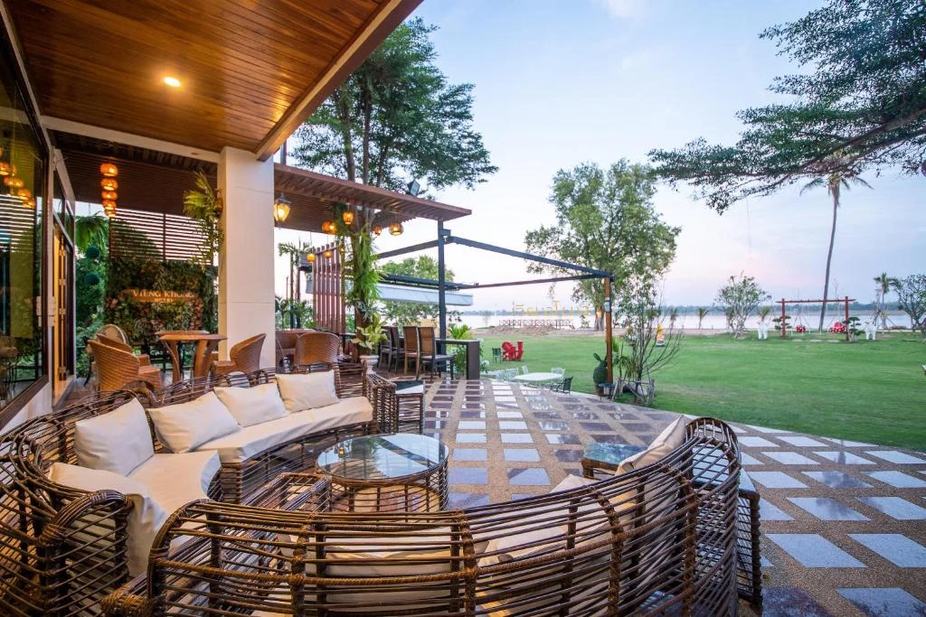 Vieng Khong Hotel riverside terrace with outdoor seating overlooking the Mekong River
