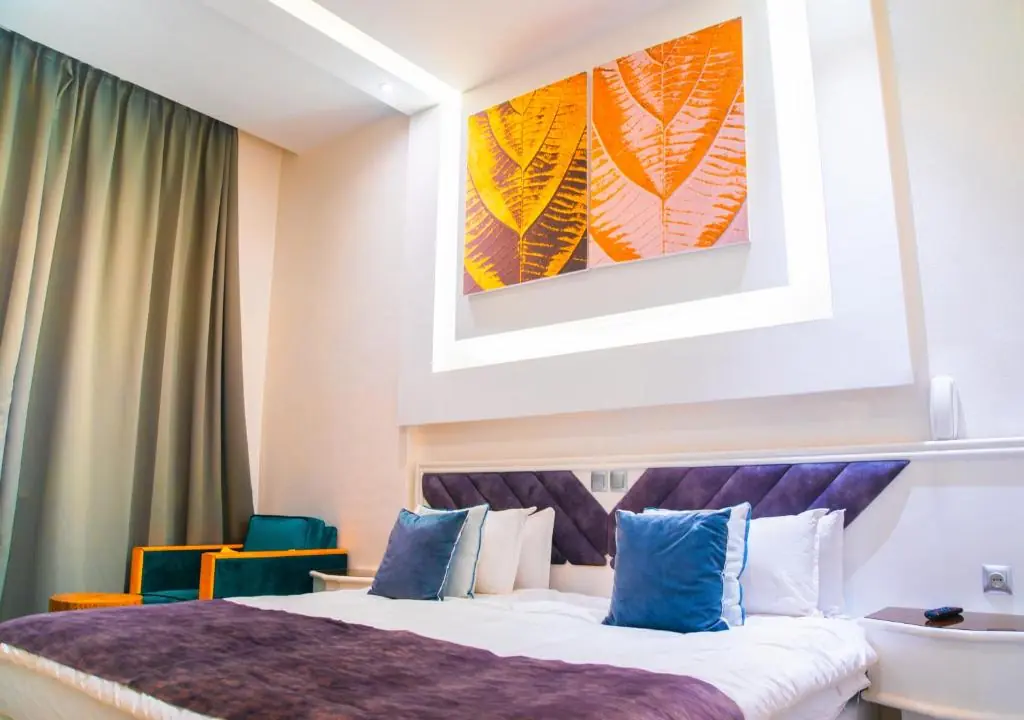 Deluxe double room with orange wall artwork at Windsor Hotel City Center Casablanca