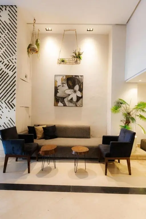 Bright lobby seating area with indoor plants at Windsor Hotel City Center Casablanca