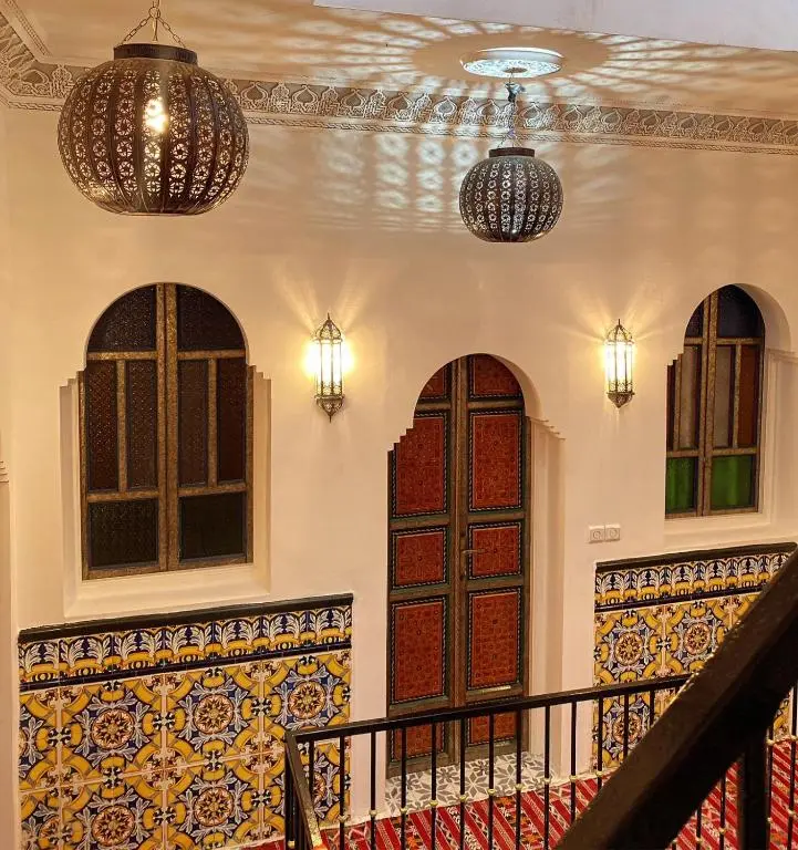 Interior atrium with decorative lanterns at Zoco Riad
